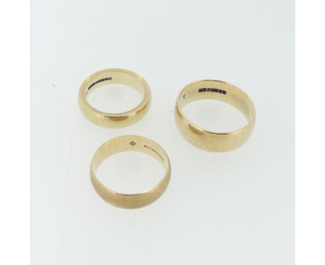 A thick 9ct yellow gold Band, Size K½, together with two others, Size R and M½, total weight 14.3g (3) 