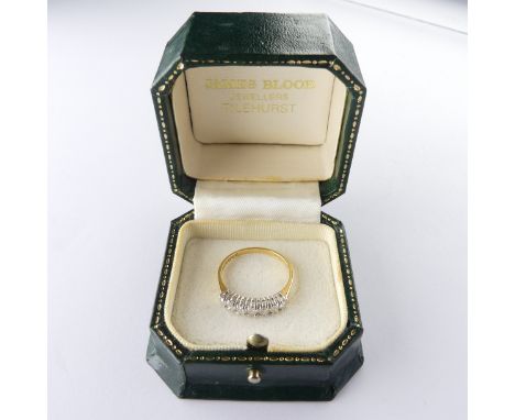 An 18ct yellow gold seven stone diamond Ring,&nbsp;estimated total diamond weight 0.5ct, claw set in white gold, with yellow 