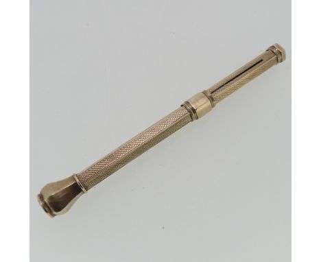A yellow metal Propelling Pencil, unmarked but tested as 9ct gold, with engine turned decoration, vacant cartouche and bloods