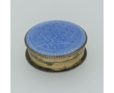 An Edwardian silver gilt and enamel Pill Pot, by&nbsp;Lawson Ward &amp; Gammage Ltd., hallmarked Birmingham, 1910, the lift o