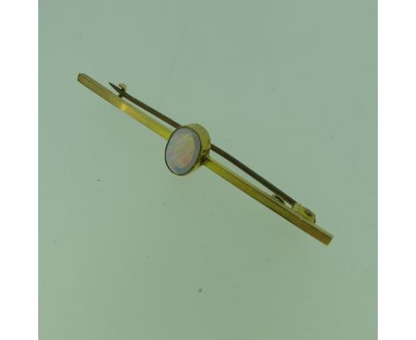 An opal Bar Brooch,&nbsp;the oval stone approx 8.4mm, millegrain set in the centre of the plain 9ct gold bar, 5.5cm long, tot