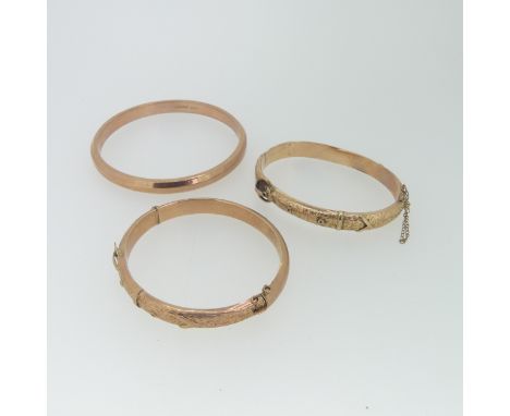 Two 9ct rose gold hollow hinged Buckle Bangles,&nbsp;as found,&nbsp;together with a plain 9ct rose gold hollow bangle, total 