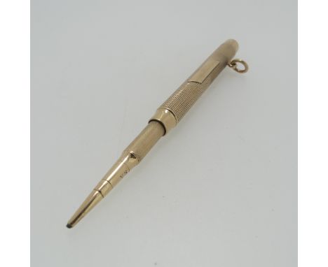 Sampson Mordan; A 9ct gold Propelling Pencil, hallmarked London, 1916, the body with engine turned decoration, push button to