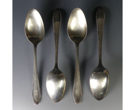 A set of four early 20thC German (800) silver Table Spoons, by Egersdoerfer, beaded handles, initialled, 21cm long, approx to