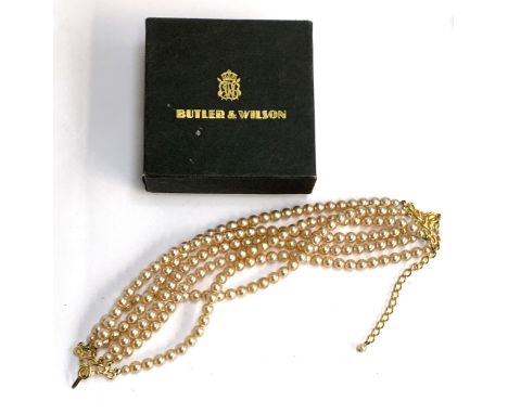 A Butler &amp; Wilson faux pearl six strand necklace, in original box bearing Harrods label, 41cmL 