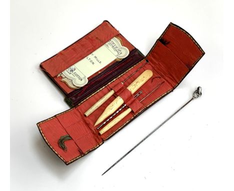 An early 20th century Charles Horner silver hat pin; together with a leather cased set of bone handled sewing tools 