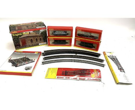 Two Hornby R4135 OO Gauge Four-Wheel coaches '350', an OO Gauge ESG Machinery wagon, an LMS wagon, a double track level cross