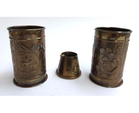 A Trench Art brass ashtray with Royal Artillery “Ubique” motto &amp; seven-flame grenade crest, together with two Arts &amp; 