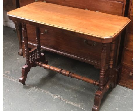 A late 19th century mahogany centre table, the rectangular top with canted corners, on turned supports, joined by a turned st