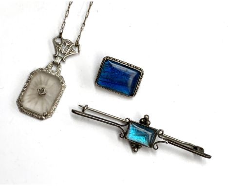 An Art Deco butterfly wing and silver brooch, 1.8cmW; together with a further butterfly wing and silver bar brooch (af); and 