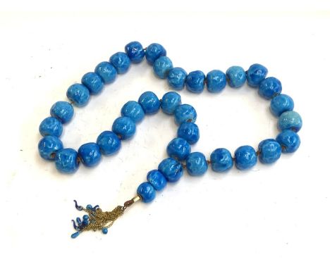An extremely large string of blue ceramic beads 