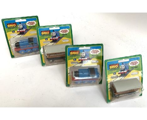 Four unopened Brio Thomas the Tank Engine &amp; Friends wooden railway locomotives and carriages comprising Thomas x2, Annie 