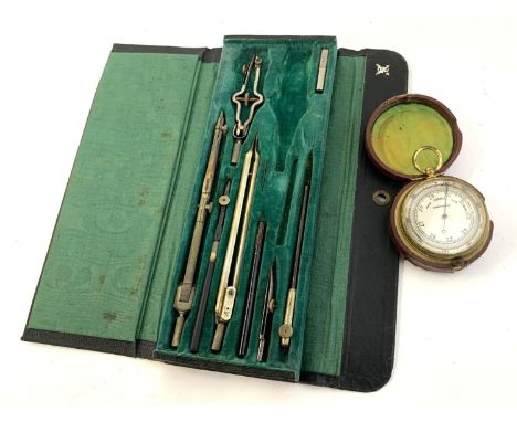 A pocket barometer, 47mmD, together with a navigator's set 