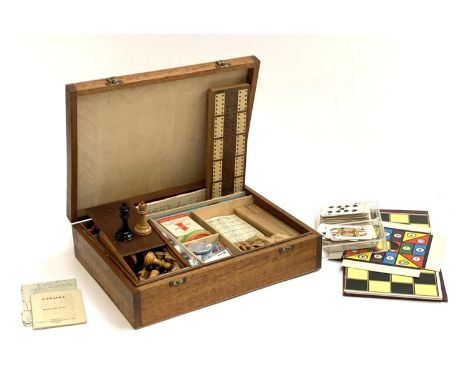 A vintage games compendium comprising cribbage, chess, canasta, wooden scrabble letters etc 
