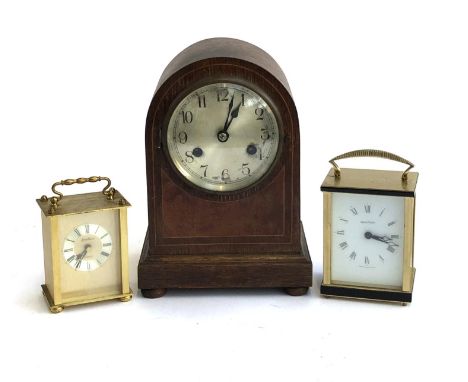 A domed oak mantel clock; together with two modern carriage clocks 