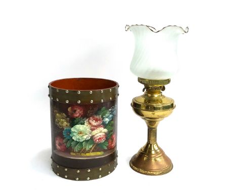 A leather style hand painted waste paper basket, 29cmH; together with a gilt metal oil lamp with frosted glass shade, 47cmH 