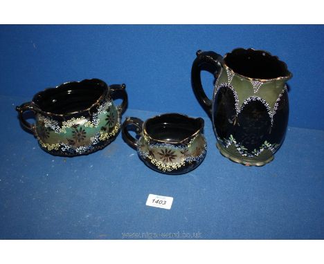Two Victorian Jugs and sucrier in green, black and gold (sucrier chipped rim).