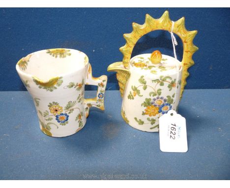 An unusual 19th Century Cantagalli teapot painted with flowers, 6 1/2'' tall and a matching jug,4'' tall cockerel marked. Som