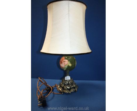 A very unusual 1960's Moorcroft table lamp; green with pink coral Hibiscus pattern. Shade has a gold effect metal base. 14" t