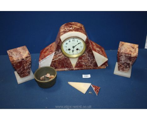 A marble Art Deco mantle clock with two garnitures Burgundy and cream a/f. Clock - 8 1/2" tall. Garnitures - 5 1/2" tall.