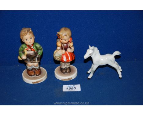 A pair of Goebel figures; School Girl (having a small chip on cheek) and Trumpet Boy. Along with a small dapple grey Beswick 