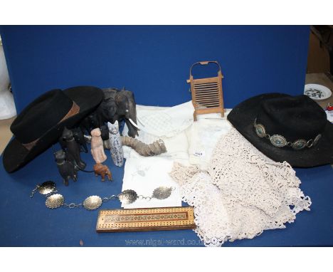 A quantity of miscellanea to include; drawn thread and embroidered linen, Fedora hats size 7, ebonised elephants, cribbage bo