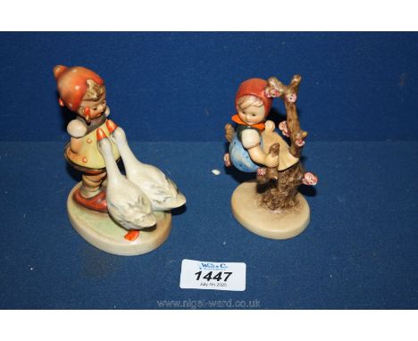 Two Goebel Hummel figures of a little girl with geese and a little girl sitting in a tree.