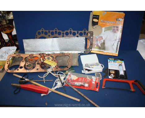 A quantity of motor car related items including a New Old Stock Cylinder Head Gasket No. 472 and four individual exhaust mani