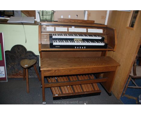 A Viscount Domus DK520 electric Organ having two 56 key manuals and 27 pedal keyboard, 38 stops, six position transposer, lou