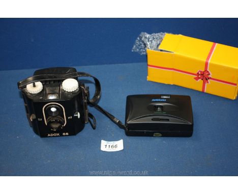 An Adox 66 Bakelite box camera and a Panorama 35mm film camera.