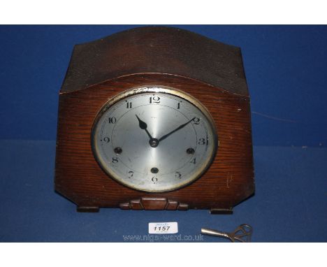 A mantle Clock having Westminster chimes, Enfield maker, with key.