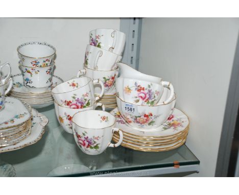 A Royal Crown Derby Teaset, in ''Derby posies'' design to include six cups and saucers, six plates, milk jug and sugar bowl. 