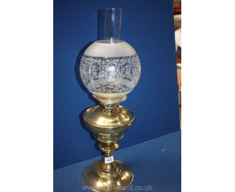 A brass Oil Lamp with etched glass dome shade. 22" tall.