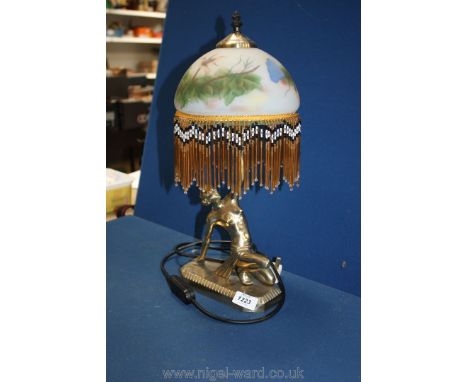 A brass lady Art Deco style figure Lamp with fringed glass shade.