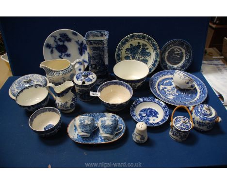 A quantity of blue and white china including:  Masons tea cup, 'Yuan' jug, Wedgwood 'Woodland' coffee cups, square vase, lidd