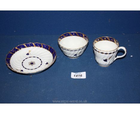 A Flight Worcester Trio in spirally fluted Blue Bell pattern comprising tea bowl, coffee cup and saucer, circa 1785, crescent