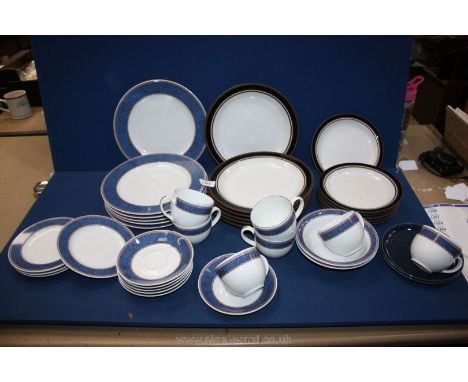 A quantity of dinnerware including; Royal Worcester with wide blue border and rope twist design (some chips), Hornsea 'Contra
