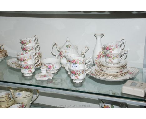 A Royal Albert 'Moss Rose' tea service for eight, plus bud vase and chamber stick.