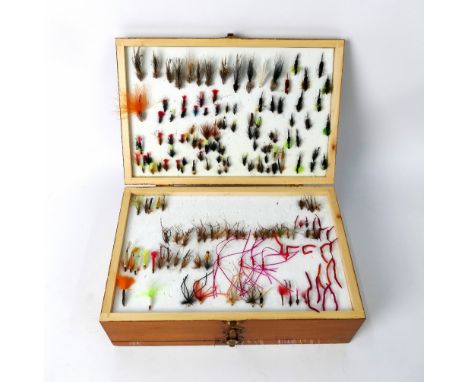 A still water wooden double sided fly box, containing various trout lures etc.