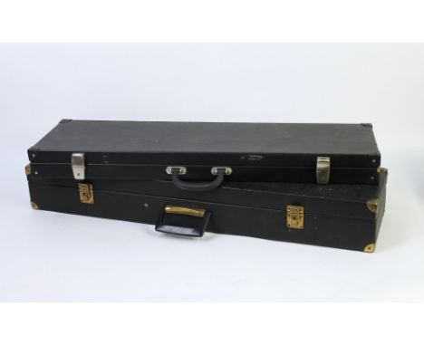 Two shotgun motorcases, both with green baize interiors with space for 30" barrels.