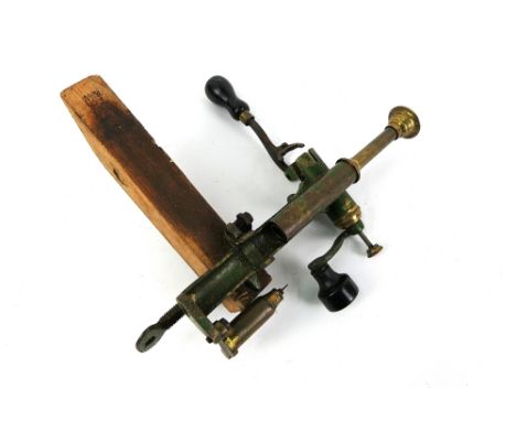 A vintage reloading machine, stamped 12, combined capper decapper roll turnover etc.
