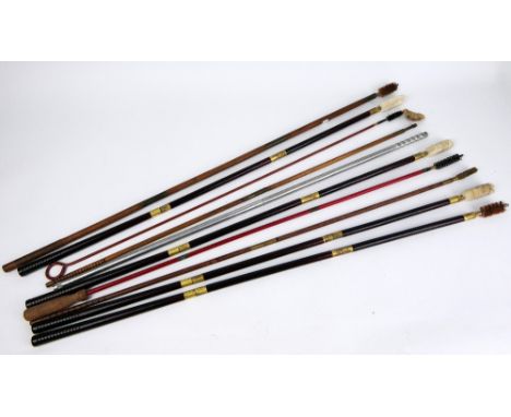 A bundle of vintage and modern shotgun cleaning rods.