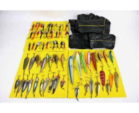 Seventy one assorted lures, Toby's, Flying C's, plug baits and ten storage cases.