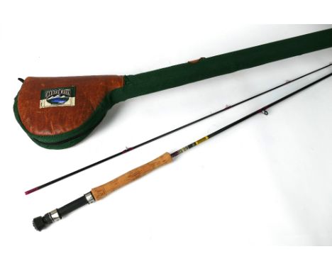 A trout fly rod in two sections, 9' line 6-7, together with a Clear Creek rod tube with combined leather reel pouch.&nbsp; Le