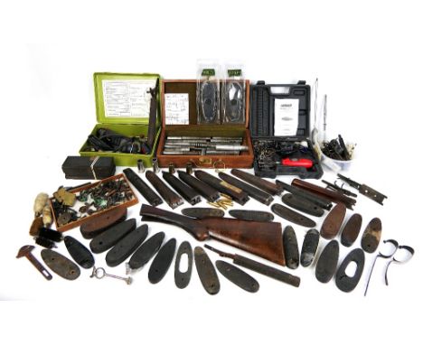 A box of shotgun dent raising equipment, various shotgun spare parts, trigger guards, triggers etc.