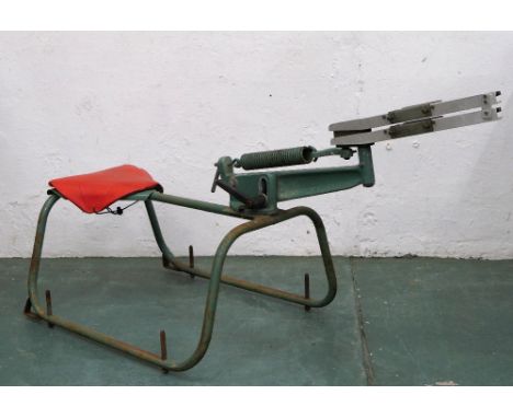 A Bowman manual clay pigeon trap with integrated seat.