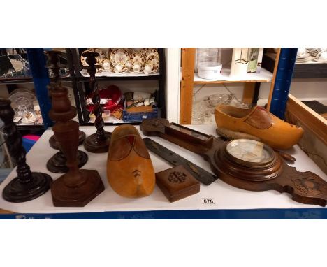 A barometer, clogs and wooden candlesticks. 