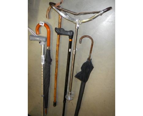 A quantity of walking sticks, shooting stick etc., 