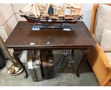 An Edwardian oak fold over tea/card table on Queen Anne legs, COLLECT ONLY.