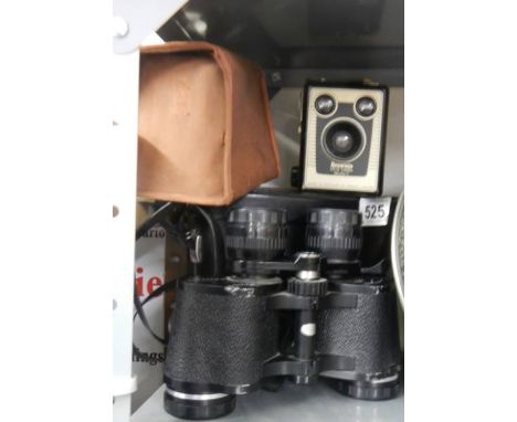 A cased pair of binoculars and a vintage camera. 